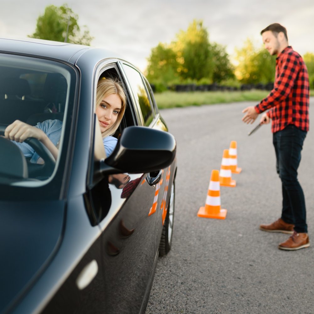 male-instructor-happy-with-driving-of-his-student.jpg